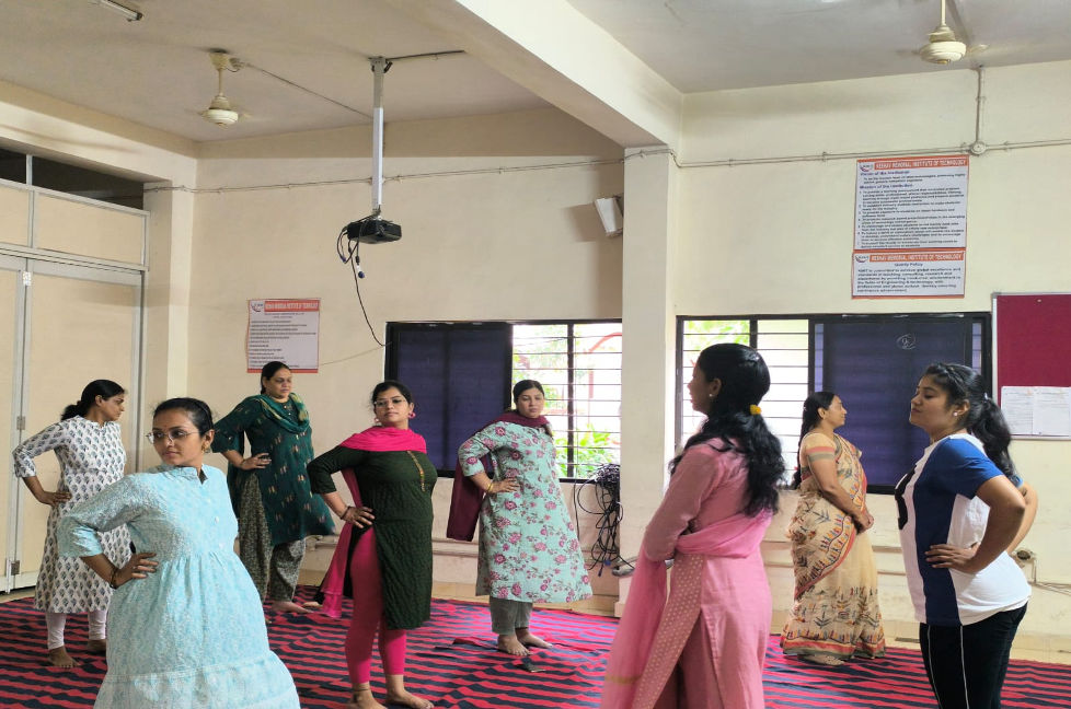 Students and faculty practicing yoga on Yoga Day 2025